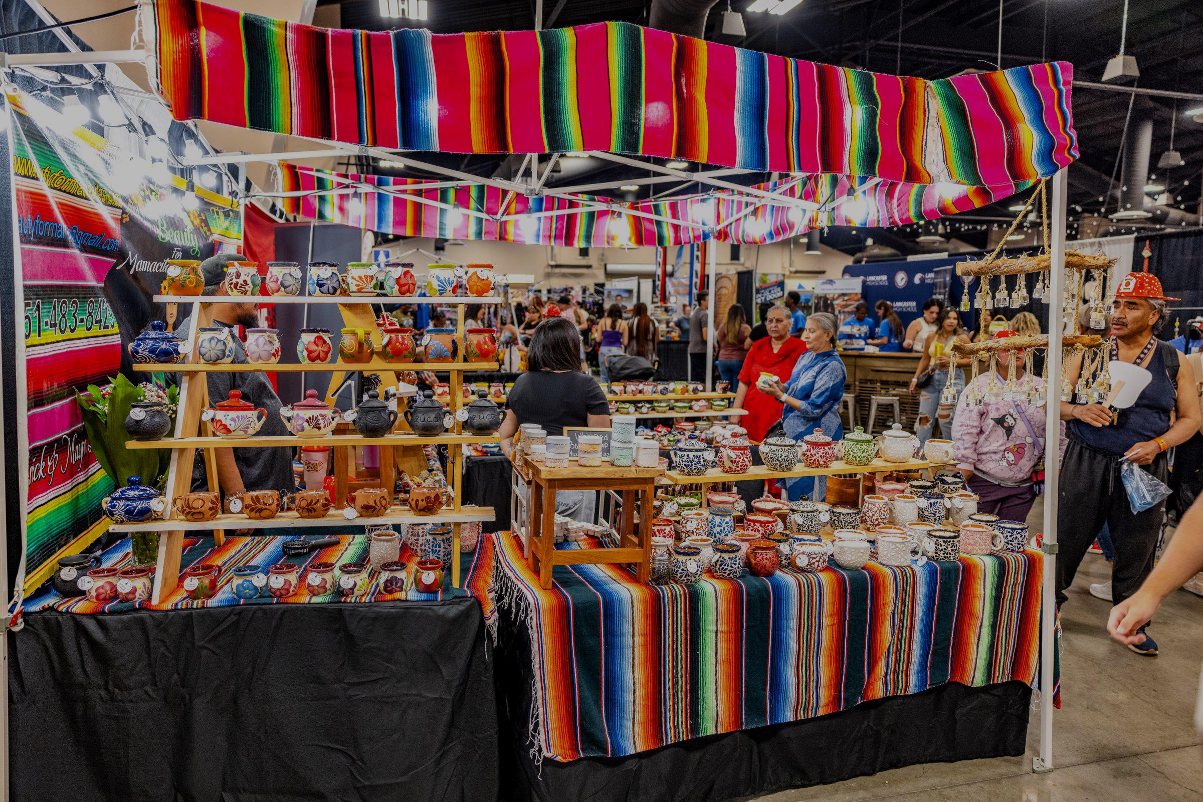 Multiple booths with people engaging